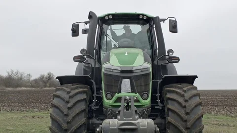 Tractor driver is turning machine headlights on Stock Footage 70081781
