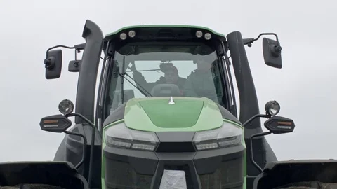 Tractor driver is turning machine lights on Stock Footage 70081839
