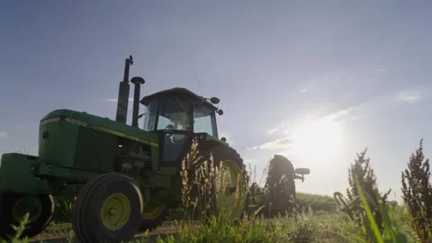 Tractor drives by on farm Stock Footage 284111962