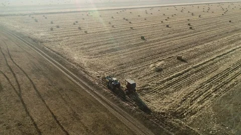 Tractor is driving across the field Stock Footage 147388733