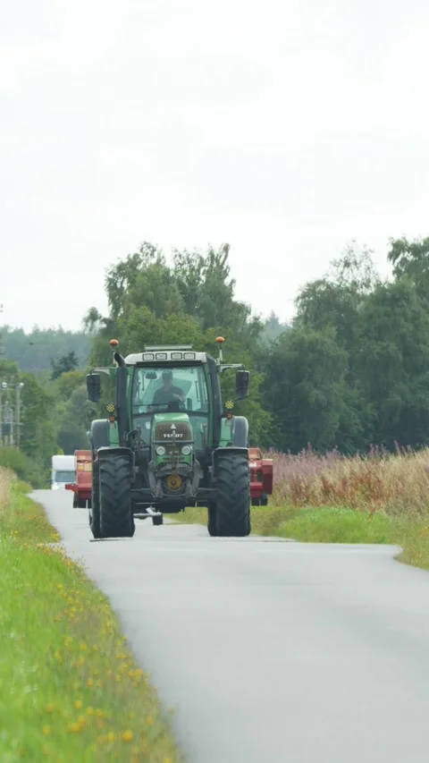 Tractor Driving Down Rural Road in Scottish Highlands Vídeo Stock 315022184