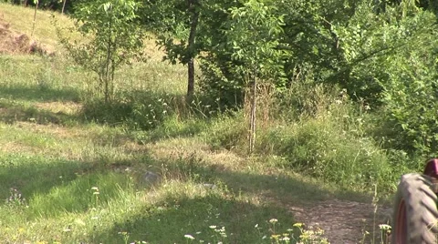 Tractor driving downhill: two shots Stock Footage 1070278