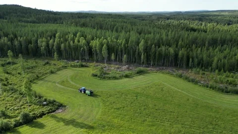 Tractor Driving In Field With Baler During Summer From Afar Stock Footage 214275491