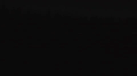 Tractor driving through an explosion during night 動画素材 61405510