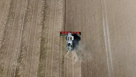 A tractor is driving through a field of dirt Stock Footage 297950679