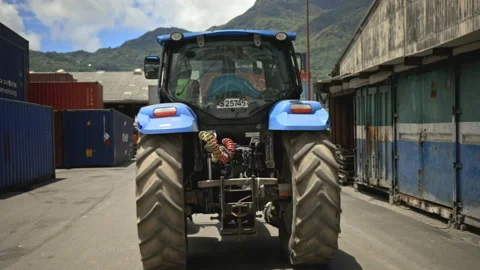 Tractor driving through shipping container terminal, HD Stock Footage 236553385