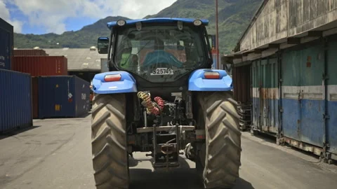 Tractor driving through shipping container terminal, UHD25p Stock Footage 246486206