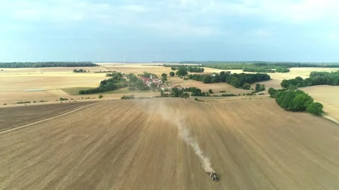 Tractor in Drought Struck Field, Leaving Dust Trail - Haute Marne, France 4K Stock Footage 259847716
