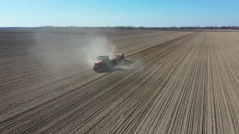 Tractor in the dust working in the field. Stock Footage 128276437