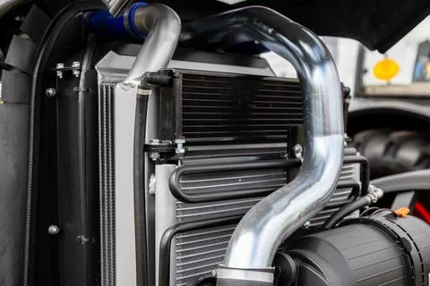 Tractor engine radiator cooling system with silver metal pipe Stock Photos