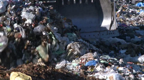 TRACTOR AT ENVIRONMENTAL LANDFILL GARBAGE DUMP AND RECYCLING  HD  1080 1920X1080 Stock Footage 33420823