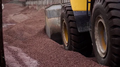 The tractor equalizes the rubble on the ground. Tractor wheels. Stock Footage 196087701