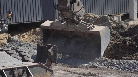Tractor excavator on construction site Видео 332933297