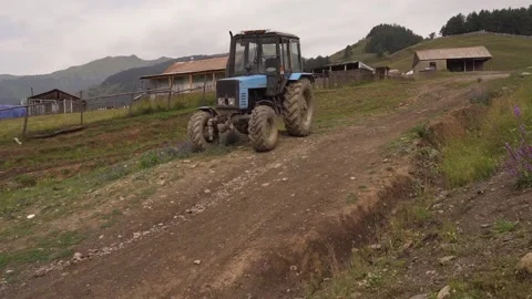 Tractor in farm in mountines Stock Footage 141952859