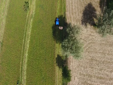 Tractor in the field - Aerial view with drone Stock Footage 76801374