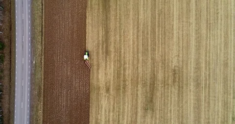 Tractor at the field captured from above 1 Stock-Footage 119945668