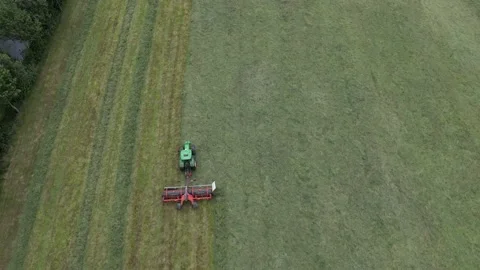 Tractor in field cutting grass. Stock Footage 207745752