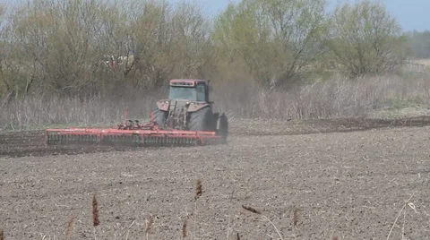 Tractor on field, farming Stock Footage
