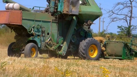 Tractor In Field Harvests Video stock 93735619
