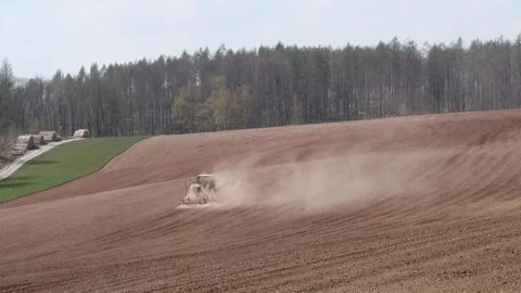 Tractor on the field with a lost of dust because of the dry field Stock-Footage 153161989