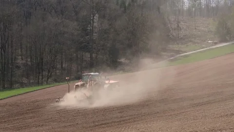 Tractor on the field with a lost of dust because of the dry field Stock-Footage 153162148