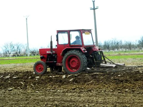 Tractor on the field in Maramures Fotos Stock