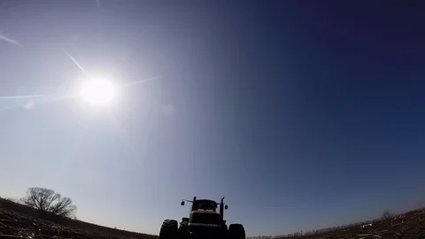 Tractor on the field moves the camera Video stock 88883549