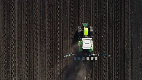 Tractor in the field, sowing corn Stock Footage 93304104