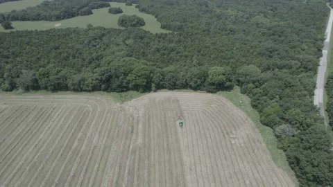 Tractor Fly By High w Camera Pullup Stock Footage 158346665