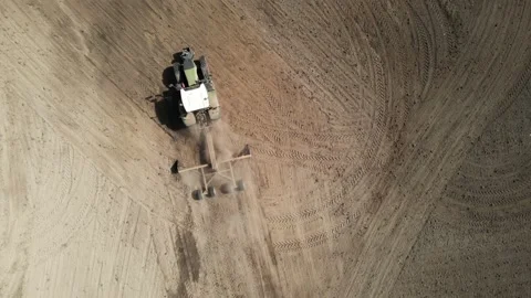 Tractor grading dirt drought aerial birdseye Stock-Footage 149642454