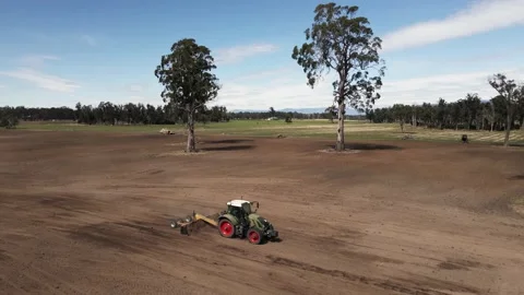 Tractor grading dirt drought trees aerial Stock-Footage 149642506