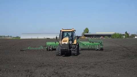 Tractor handles field Stock Footage 75040403