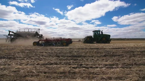 Tractor handles the field 스톡 동영상 169918840