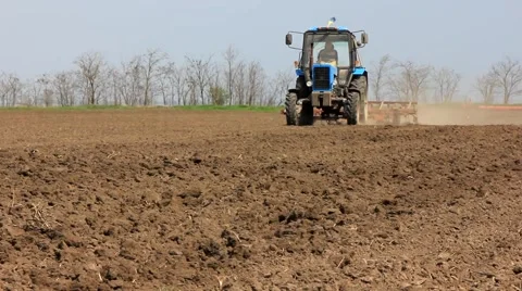 Tractor harrow field Stock Footage 62375475