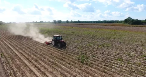 A tractor is harvesting in the field Stock Footage 150484735