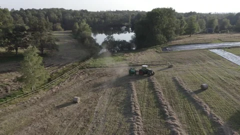 The Tractor With Hay Baler Video stock 164868403