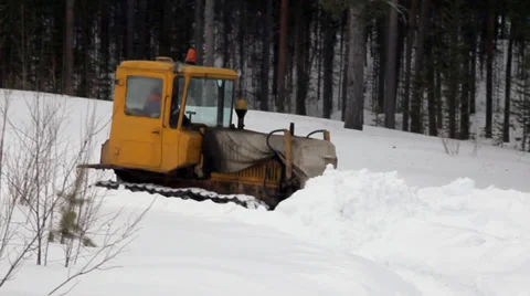 Tractor hit the road in the snow Stock Footage 37127439