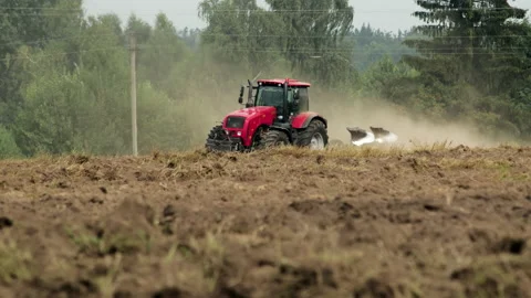 Tractor inefficiently processes arable land with compaction of the soil under 動画素材 142116588