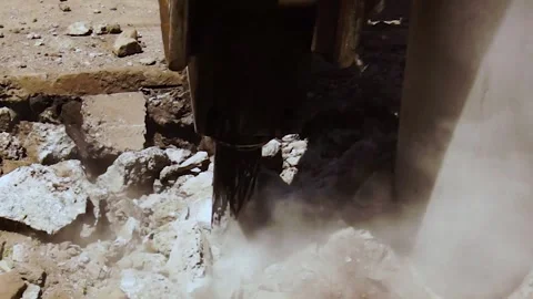 Tractor jackhammer breaking concrete pavement in sunlight, close-up view Stock Footage 312423667