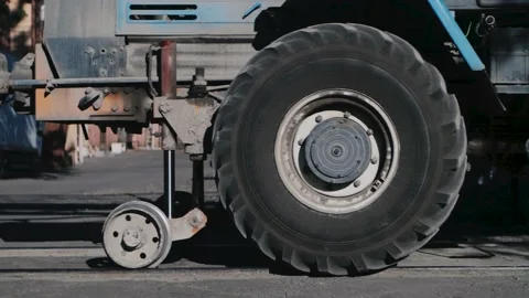 A tractor with large wheels stops Stock Footage 156680711