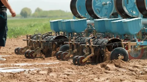 Tractor lays drip irrigation Stock Footage 327971845