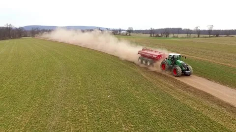 Tractor Leaving Cloud of Dust Driving Down Dirt Field Lane Aerial 스톡 동영상 61175767