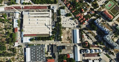 Tractor With Load Driving Through Factory District Of Small Town And Roundabout Stock Footage 289418223