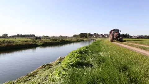 Tractor loaded with potatoes driving by Stock Footage 82076793
