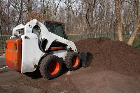 Tractor loads mulching ecology work natural recycle Stock Photos