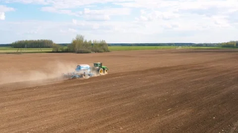Tractor Machine Sow Cereals Or Corn In Ground Agricultural Field Aerial View Stock Footage 265587697