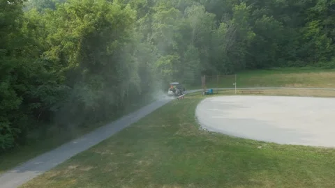 Tractor Maintaining Baseball Field with Dust Cloud on Sunny Summer Morning Video stock 314477247
