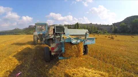 Tractor Making Hay Bales Stock Footage 140281051