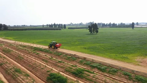 Tractor making his way in fields Video stock 125912260