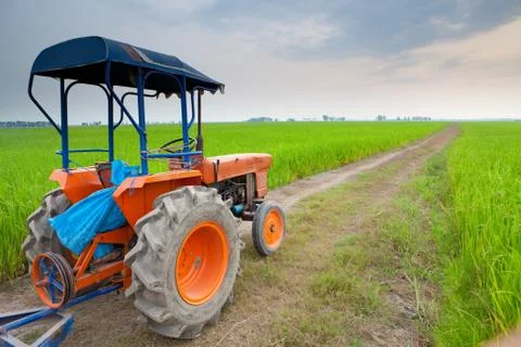 Tractor in meadow Stock Photos